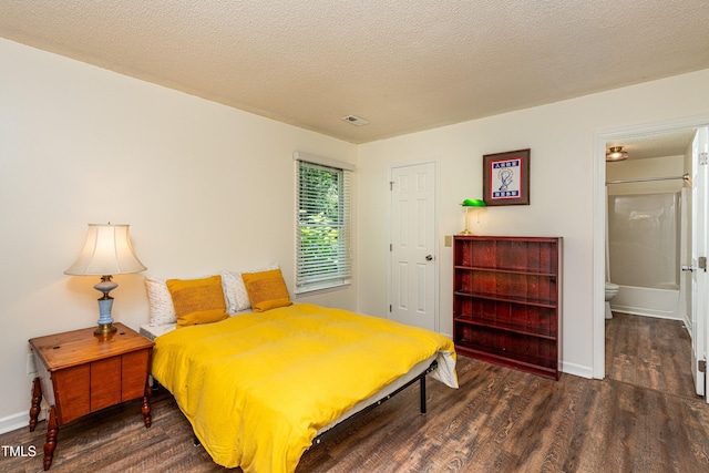 3616 Culater Ct, Raleigh, NC 27616 - bedroom with wood finished floors, a textured ceiling, and connected bathroom