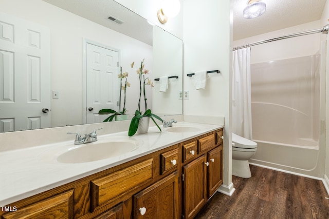 3616 Culater Ct, Raleigh, NC 27616 - bathroom with double vanity, wood finished floors, and shower / bath combination with curtain