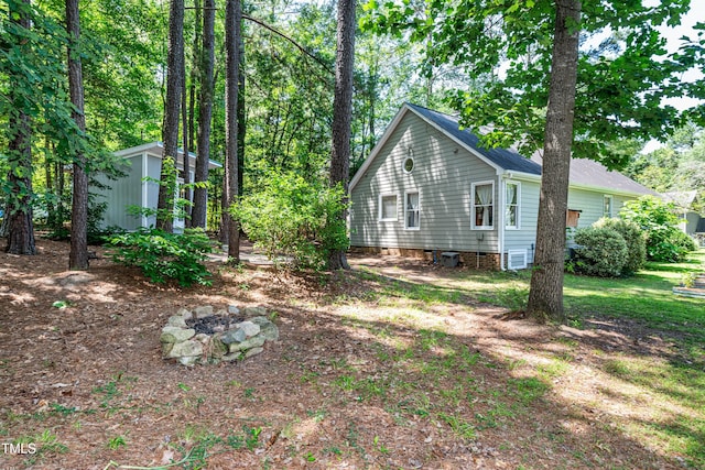3616 Culater Ct, Raleigh, NC 27616 - view of property exterior featuring a fire pit and a shed