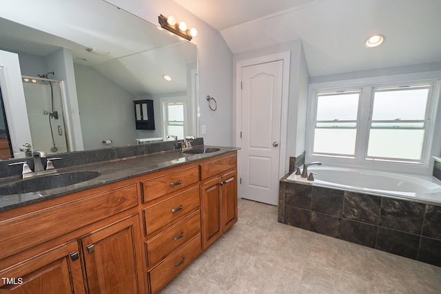 90 Liberty Ln, Autryville, NC 28318 - full bath with vaulted ceiling, double vanity, a shower stall, and a garden tub