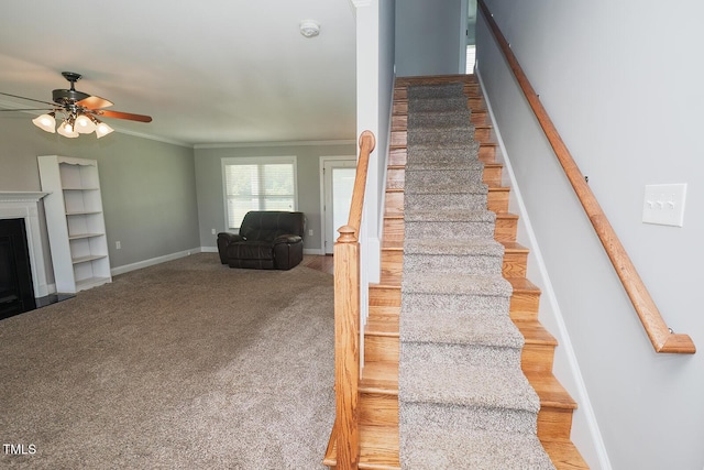 90 Liberty Ln, Autryville, NC 28318 - stairs featuring ceiling fan, ornamental molding, a fireplace, and carpet floors