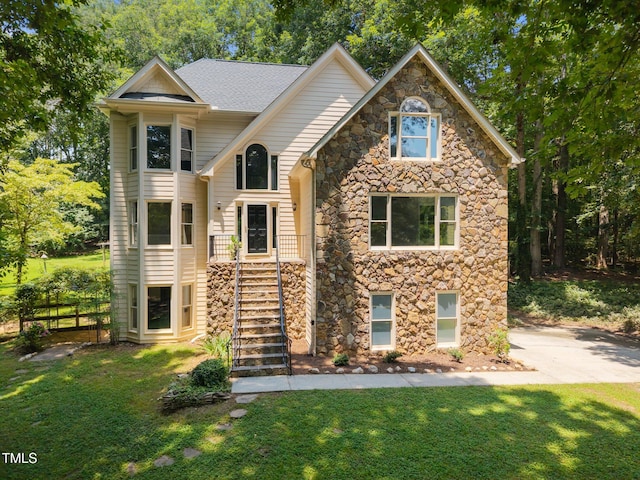 6001 Waters Way Dr, Raleigh, NC 27606 - view of front of property with stone siding, a front lawn, and stairway