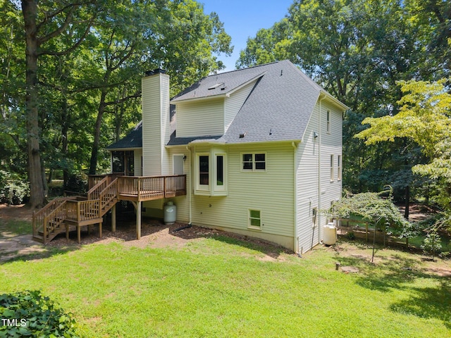 6001 Waters Way Dr, Raleigh, NC 27606 - back of property featuring stairway, a deck, a shingled roof, and a yard