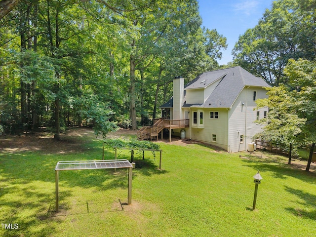 6001 Waters Way Dr, Raleigh, NC 27606 - view of grassy yard featuring a wooden deck and stairway