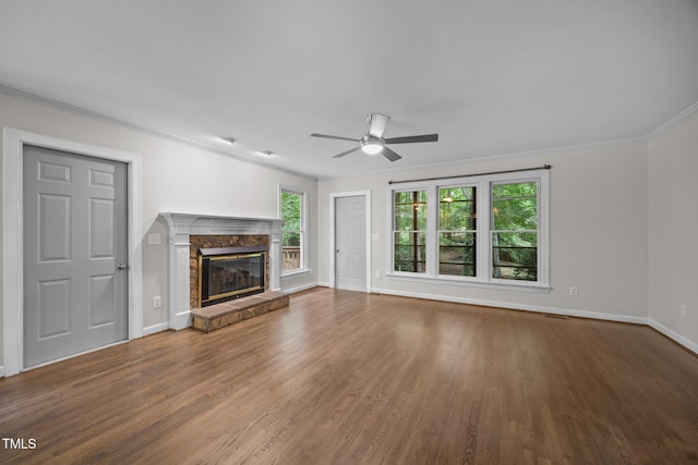 6001 Waters Way Dr, Raleigh, NC 27606 - unfurnished living room with a ceiling fan, crown molding, wood finished floors, and a fireplace