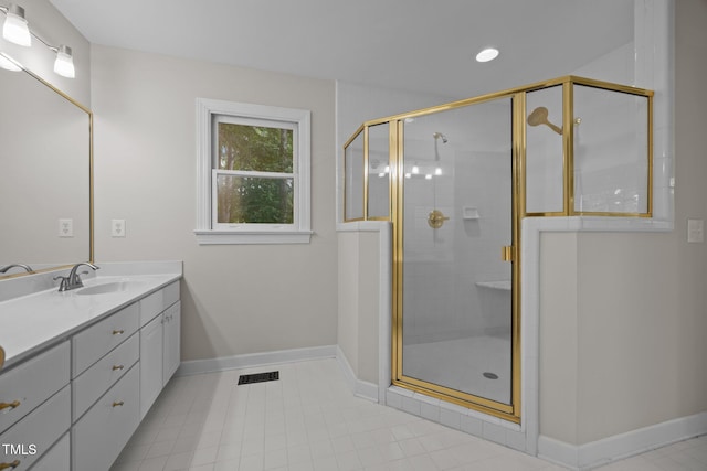6001 Waters Way Dr, Raleigh, NC 27606 - bathroom with vanity, a shower stall, and tile patterned flooring