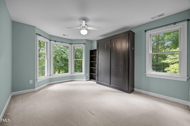 6001 Waters Way Dr, Raleigh, NC 27606 - unfurnished bedroom with light carpet, a ceiling fan, and a closet