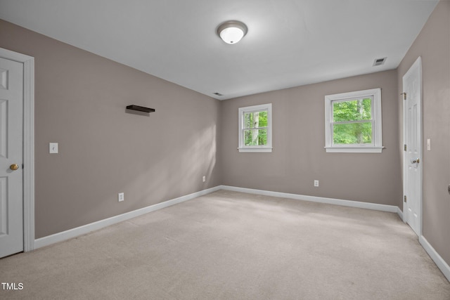6001 Waters Way Dr, Raleigh, NC 27606 - spare room featuring baseboards and light carpet