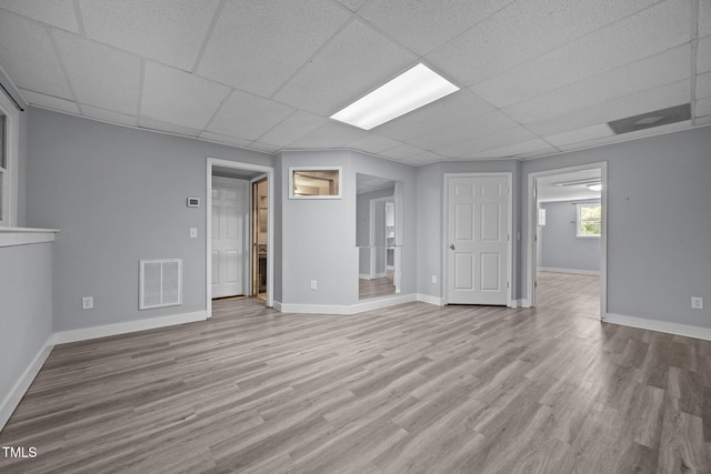 6001 Waters Way Dr, Raleigh, NC 27606 - unfurnished room with a drop ceiling and wood finished floors