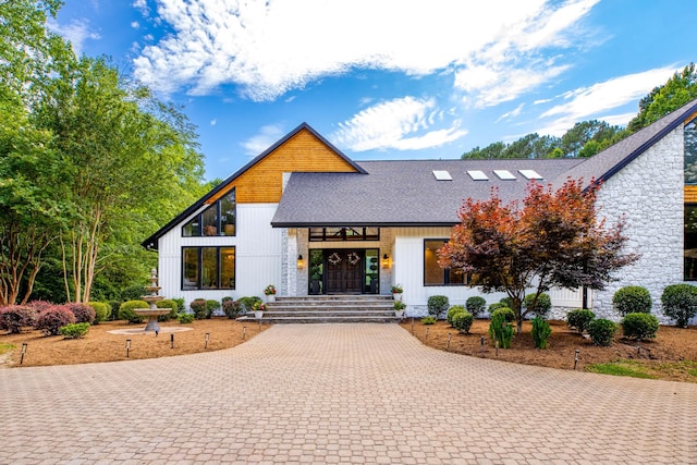 1004 Buttar Ln, Raleigh, NC 27614 - view of front facade with roof with shingles, stone siding, and decorative driveway