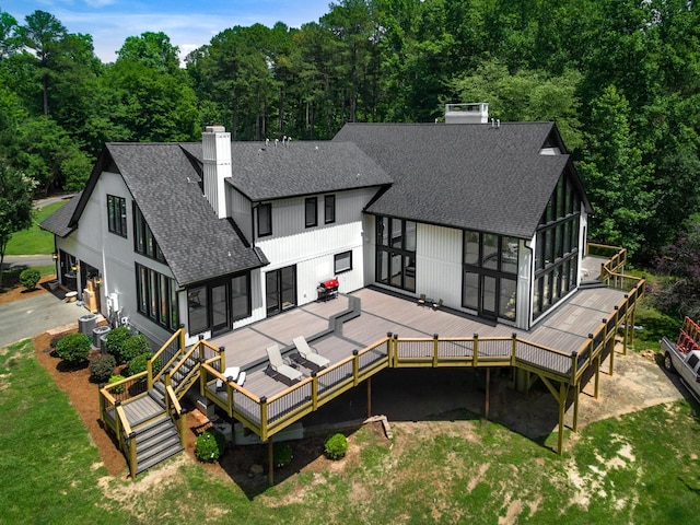 1004 Buttar Ln, Raleigh, NC 27614 - rear view of property featuring a chimney, roof with shingles, and a deck