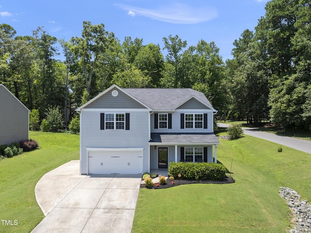 702 Pitch Pine Dr, Creedmoor, NC 27522 - traditional-style house featuring an attached garage, driveway, a front lawn, and a porch