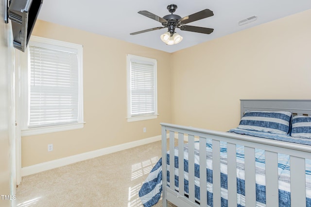2906 Brentwood Dr N, Wilson, NC 27896 - carpeted bedroom featuring baseboards and ceiling fan