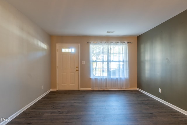 803 Creek Crossing Trl, Whitsett, NC 27377 - entrance foyer with dark wood-type flooring and baseboards