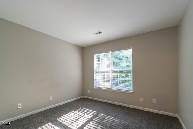 803 Creek Crossing Trl, Whitsett, NC 27377 - spare room with dark carpet