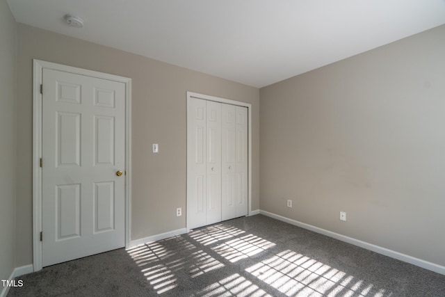803 Creek Crossing Trl, Whitsett, NC 27377 - unfurnished bedroom featuring carpet flooring and a closet