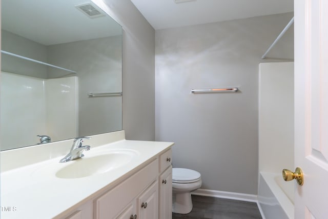 803 Creek Crossing Trl, Whitsett, NC 27377 - full bath featuring vanity, wood finished floors, and bathing tub / shower combination