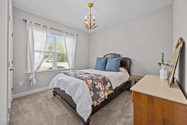 244 Lasswade Ct, Zebulon, NC 27597 - carpeted bedroom with a chandelier and baseboards
