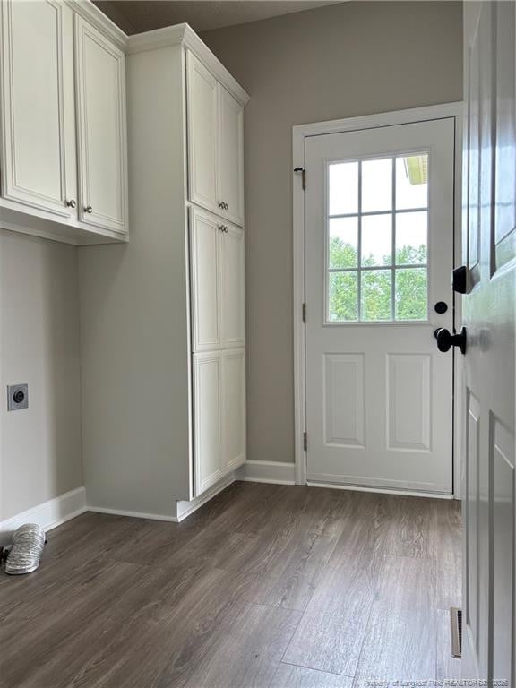 518 Maple Leaf Way, Lumberton, NC 28358 - laundry area featuring cabinet space, hookup for an electric dryer, and dark wood finished floors