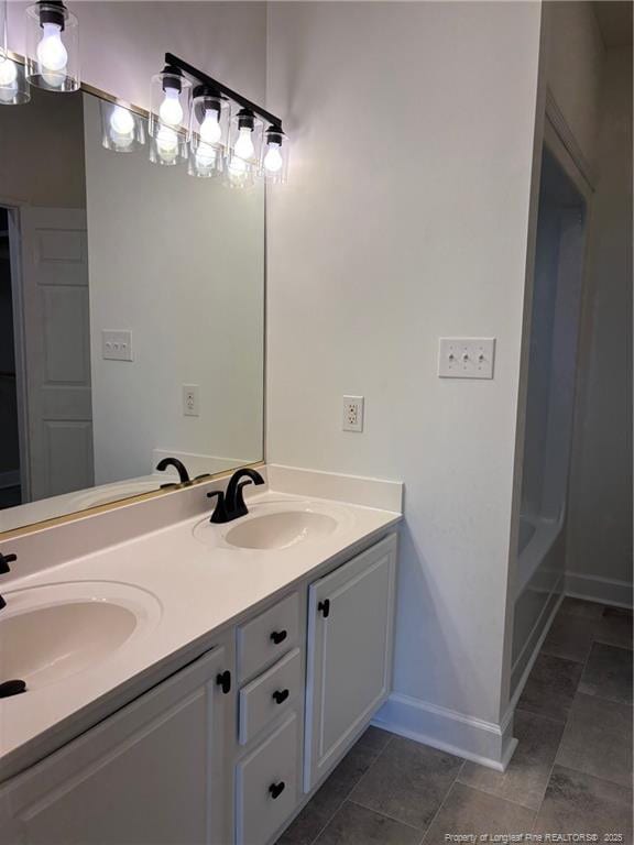 518 Maple Leaf Way, Lumberton, NC 28358 - bathroom featuring double vanity and baseboards
