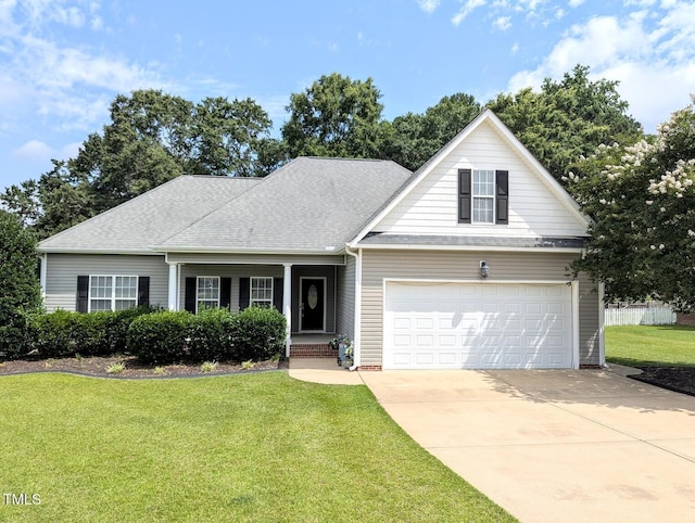 70 Dexterfield Dr, Fuquay Varina, NC 27526 - traditional-style home featuring a front yard, a porch, driveway, a garage, and a shingled roof