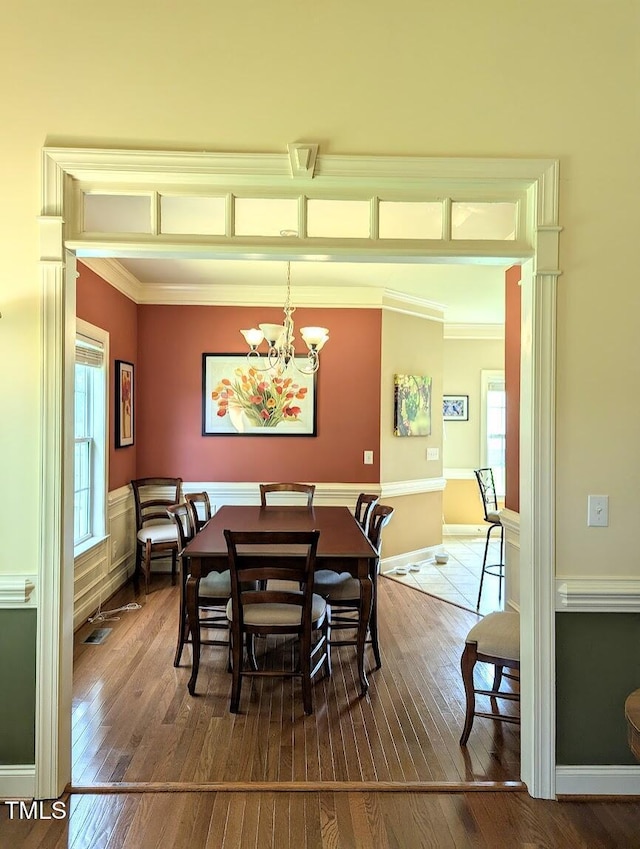 70 Dexterfield Dr, Fuquay Varina, NC 27526 - dining room with hardwood / wood-style floors, a chandelier, and ornamental molding