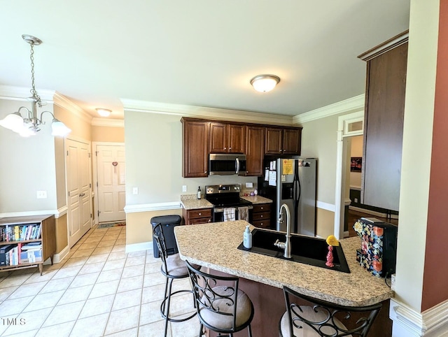 70 Dexterfield Dr, Fuquay Varina, NC 27526 - kitchen with appliances with stainless steel finishes, a peninsula, ornamental molding, a kitchen bar, and a chandelier