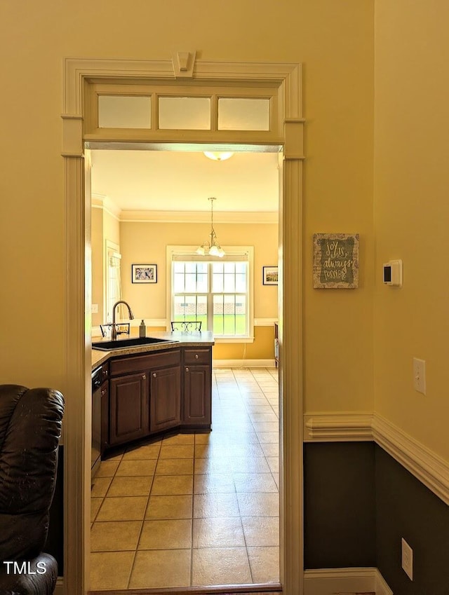 70 Dexterfield Dr, Fuquay Varina, NC 27526 - kitchen featuring light tile patterned floors, crown molding, a chandelier, dishwasher, and pendant lighting
