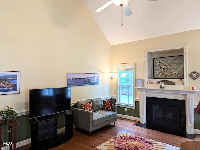 70 Dexterfield Dr, Fuquay Varina, NC 27526 - living room with a ceiling fan, high vaulted ceiling, wood finished floors, and a fireplace with flush hearth