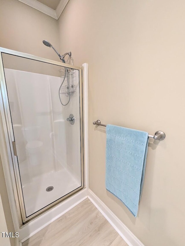70 Dexterfield Dr, Fuquay Varina, NC 27526 - bathroom with wood finished floors, a shower stall, and crown molding