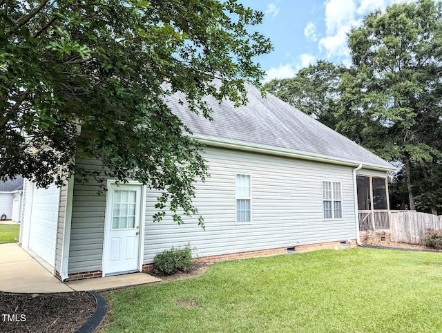 70 Dexterfield Dr, Fuquay Varina, NC 27526 - rear view of house featuring a garage, a sunroom, a yard, a shingled roof, and crawl space