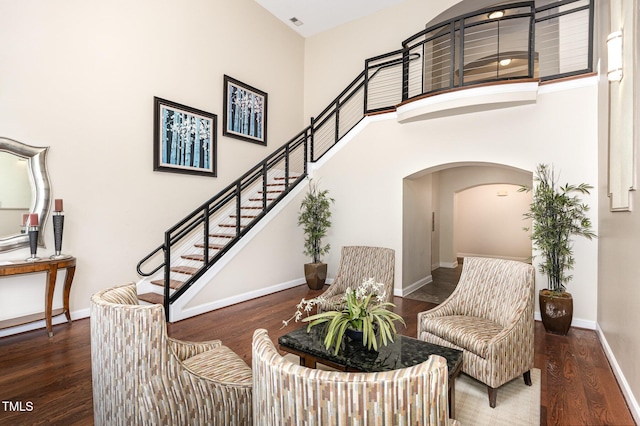 7250 NC-751 Hwy, Durham, NC 27707 - living area with wood finished floors, arched walkways, stairway, and a towering ceiling