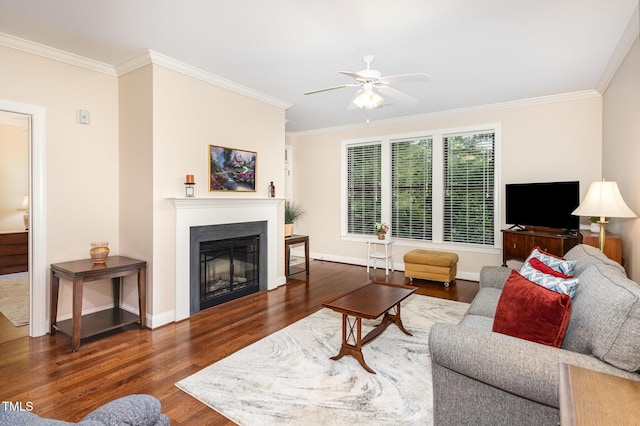 7250 NC-751 Hwy, Durham, NC 27707 - living area featuring crown molding, ceiling fan, wood finished floors, and a glass covered fireplace
