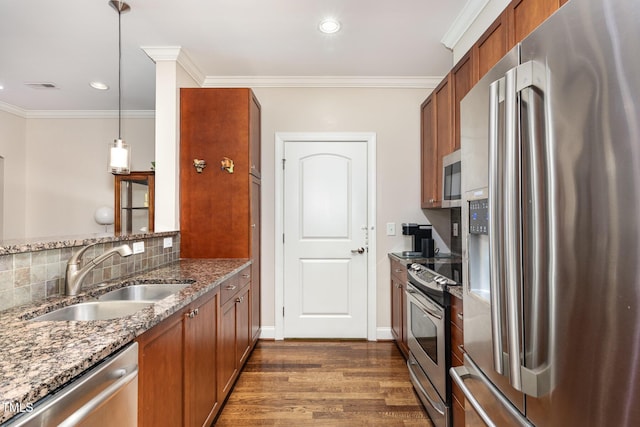7250 NC-751 Hwy, Durham, NC 27707 - kitchen featuring appliances with stainless steel finishes, brown cabinetry, dark wood-style flooring, stone countertops, and recessed lighting