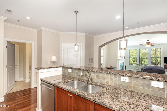 7250 NC-751 Hwy, Durham, NC 27707 - kitchen with brown cabinets, dishwasher, arched walkways, open floor plan, and dark wood finished floors