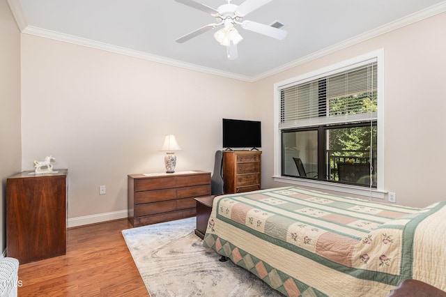 7250 NC-751 Hwy, Durham, NC 27707 - bedroom with crown molding, wood finished floors, and a ceiling fan