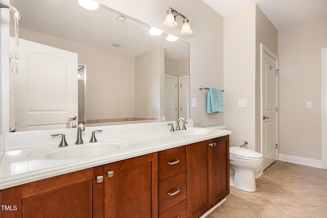 7250 NC-751 Hwy, Durham, NC 27707 - bathroom with double vanity and tile patterned flooring