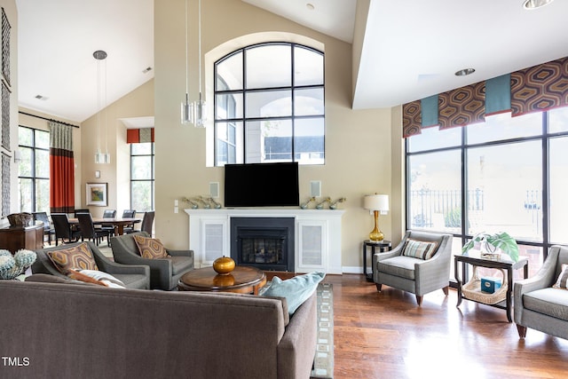 7250 NC-751 Hwy, Durham, NC 27707 - living area with high vaulted ceiling, wood finished floors, and a fireplace