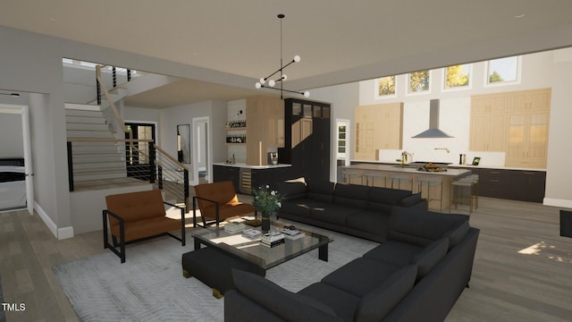 802 Warren Ave, Cary, NC 27511 - living area with light wood-style floors, stairway, and a high ceiling