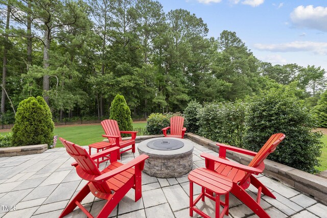 3829 Sleepy Brook Ln, Apex, NC 27539 - view of patio with a fire pit and view of wooded area