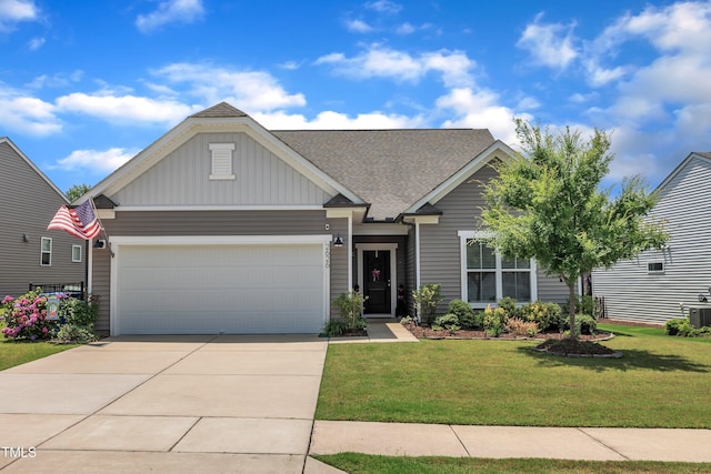 2626 Nassau Trce, Fuquay Varina, NC 27526 - craftsman-style house featuring a front lawn, a garage, driveway, board and batten siding, and roof with shingles