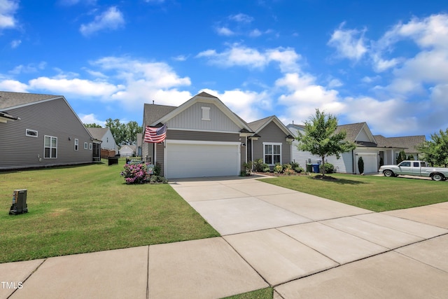 2626 Nassau Trce, Fuquay Varina, NC 27526 - view of front of home with a front yard, board and batten siding, driveway, and an attached garage