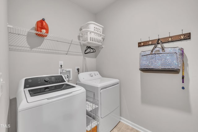 2626 Nassau Trce, Fuquay Varina, NC 27526 - washroom featuring washer and clothes dryer and light wood finished floors