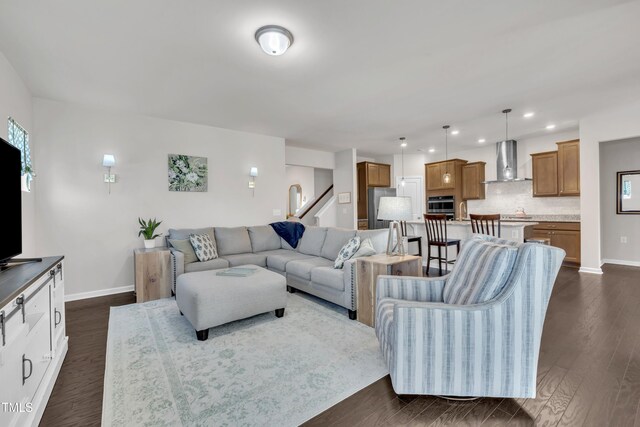 2626 Nassau Trce, Fuquay Varina, NC 27526 - living area with dark wood-style floors, stairway, and recessed lighting