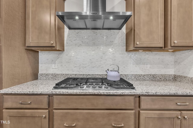 2626 Nassau Trce, Fuquay Varina, NC 27526 - kitchen with ventilation hood, stainless steel gas cooktop, backsplash, and light stone countertops