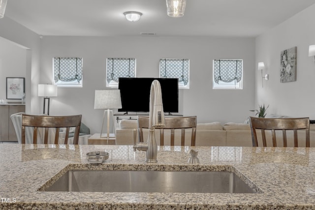 2626 Nassau Trce, Fuquay Varina, NC 27526 - kitchen with open floor plan and light stone countertops