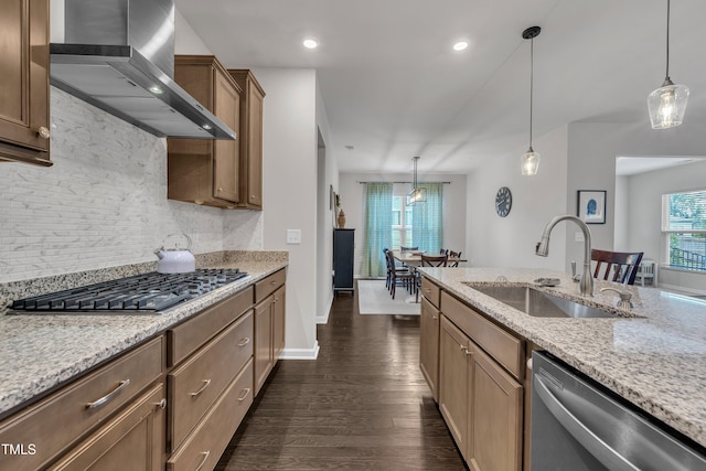 2626 Nassau Trce, Fuquay Varina, NC 27526 - kitchen with appliances with stainless steel finishes, wall chimney exhaust hood, dark wood-style flooring, backsplash, and decorative light fixtures