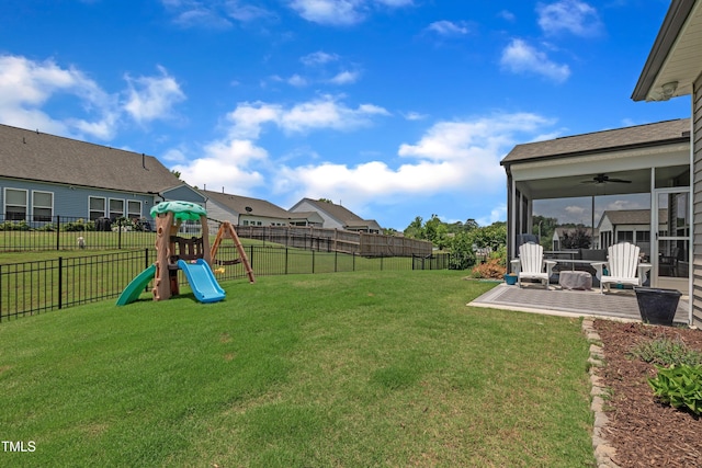 2626 Nassau Trce, Fuquay Varina, NC 27526 - fenced backyard featuring a ceiling fan, a playground, and a patio