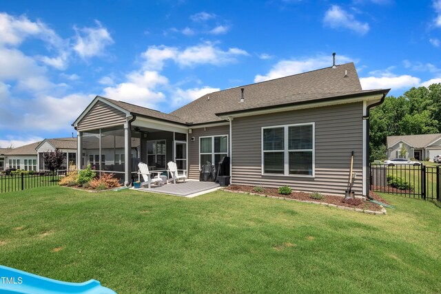 2626 Nassau Trce, Fuquay Varina, NC 27526 - back of house with a sunroom, a fenced backyard, a patio area, and roof with shingles