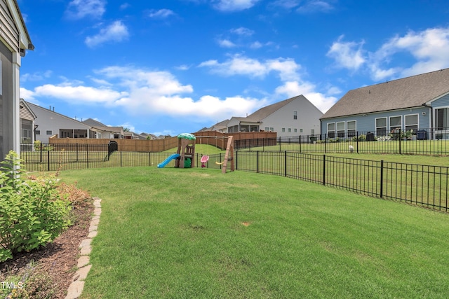 2626 Nassau Trce, Fuquay Varina, NC 27526 - fenced backyard featuring a playground and a residential view
